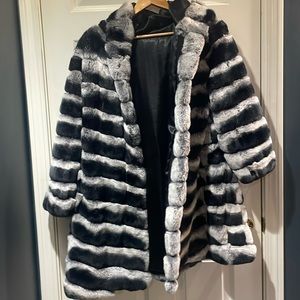 This black and white unique coat, including lambkin, comes with a matching hood